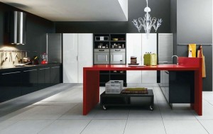 Дизайн черной кухни с яркими красными акцентами